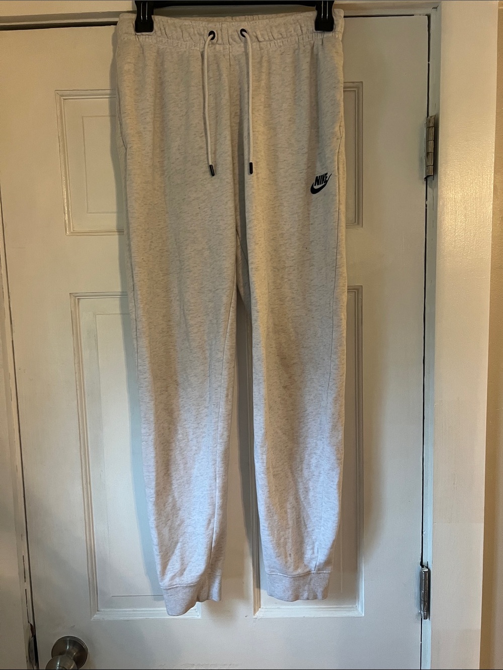Nike Unisex Adults Light Heather Gray Joggers with Black Logo Size: Small